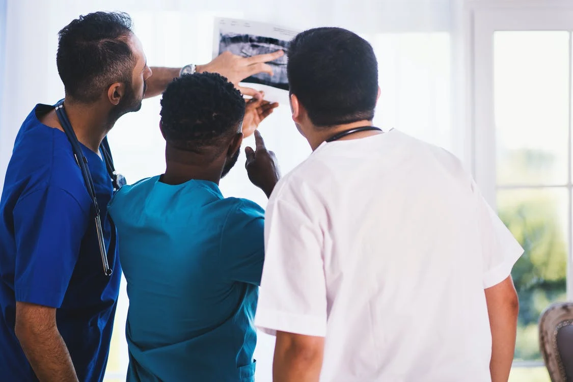 Doctors looking at an XRay