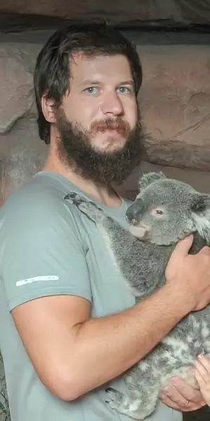 Photo of Dan holding a Koala